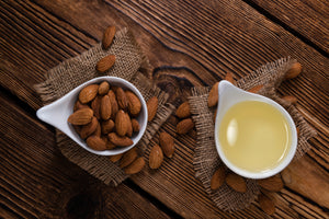  Almond oil is obtained from the ripe, shell-free seeds of the almond tree (Prunus Amygdalus L.) by mechanical pressing of selected kernels and subsequent refining. The kernels contain 40 - 50 % fatty oil. 